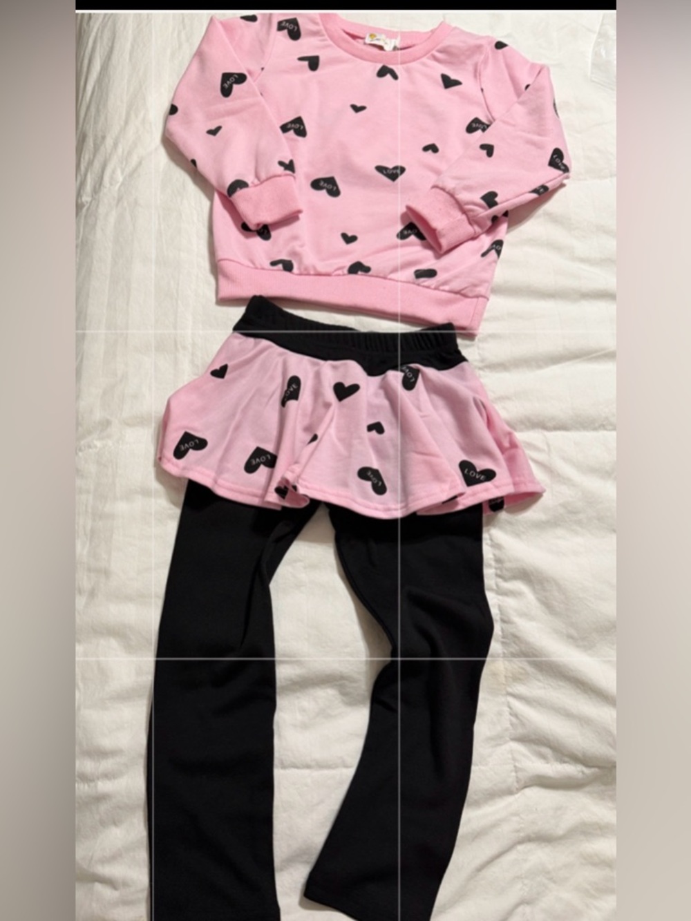 Little Hands Soft pink skirted leggings with black heart print.  2 piece set
